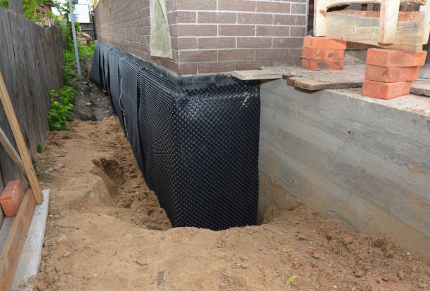 SJ Waterproofing Pros technician performing targeted Emergency Waterproofing assessment in Camden, IN